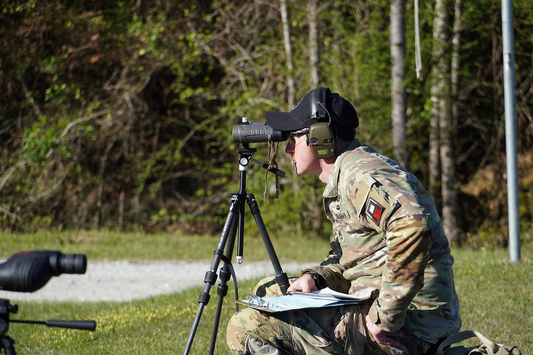 Sgt. 1st Class Corey Dougherty, 181st Multifunctional Training Brigade, First Army Division West checks his target during the 2023 U.S. Army Small Arms Championship at Fort Benning, Georgia March 15, 2023.