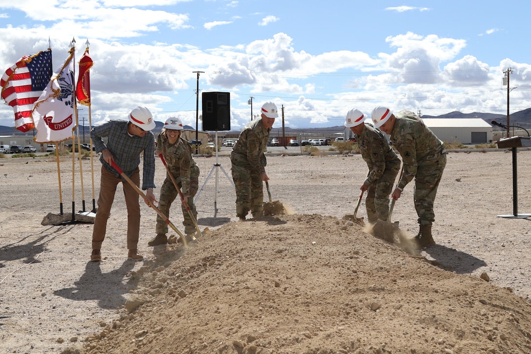 From left to right: Robert Burch, CEO of RA Burch; Col. Julie Balten, U.S. Army Corps of Engineers Los Angeles District commander; Brig. Gen. Curtis Taylor, commanding general of the National Training Center and Fort Irwin; Col. Jason Clarke, Fort Irwin garrison commander; and Lt. Col. John Williams, deputy commander for Operations Group, National Training Center, break ground for the new Simulations Center March 23 at Fort Irwin, California.