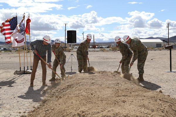 From left to right: Robert Burch, CEO of RA Burch; Col. Julie Balten, U.S. Army Corps of Engineers Los Angeles District commander; Brig. Gen. Curtis Taylor, commanding general of the National Training Center and Fort Irwin; Col. Jason Clarke, Fort Irwin garrison commander; and Lt. Col. John Williams, deputy commander for Operations Group, National Training Center, break ground for the new Simulations Center March 23 at Fort Irwin, California.