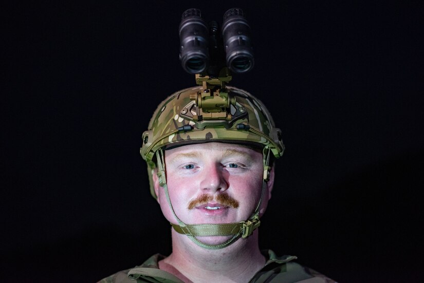 Photo of an air traffic controller with night vision goggles