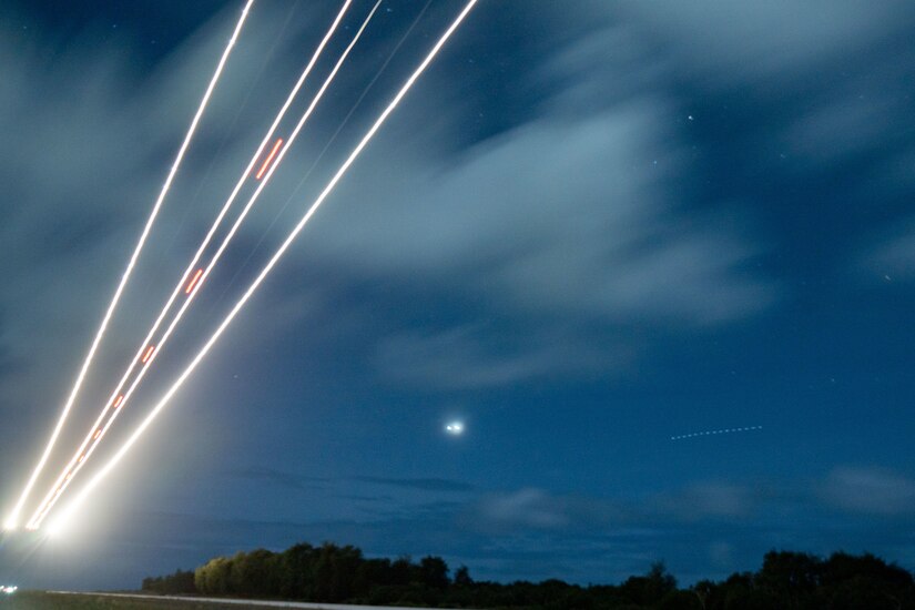 Photo of a C-17's lights at night