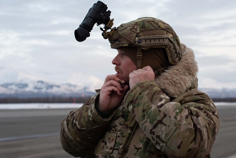 Photo of an air traffic controller preparing night vision goggles