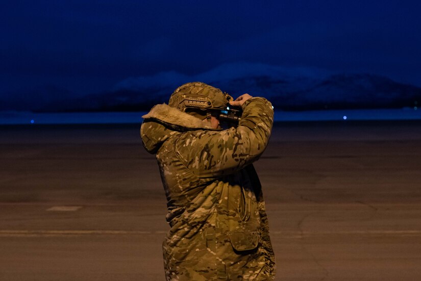 Photo of an air traffic controller using night vision goggles