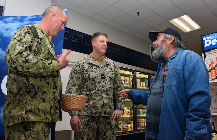 U.S. Navy Capt. Frank Ingargiola, Joint Base McGuire-Dix-Lakehurst deputy commander and Naval Support Activity commander, and U.S. Navy Cmdr. Craig Speer, NSA Lakehurst executive officer, greet a veteran at a Vietnam veterans recognition ceremony at Joint Base McGuire-Dix-Lakehurst, N.J., Mar. 29, 2023. The purpose of this ceremony was to honor and thank the veterans who served their country with courage and selflessness during the Vietnam War, as part of the nationwide effort to recognize their contributions and sacrifices. Since 2018, the Navy Exchange located on Joint Base MDL has been holding this annual ceremony, which has become an important tradition to express appreciation and respect for the brave men and women who risked their lives for the nation. (U.S. Air Force photo by Daniel Barney)