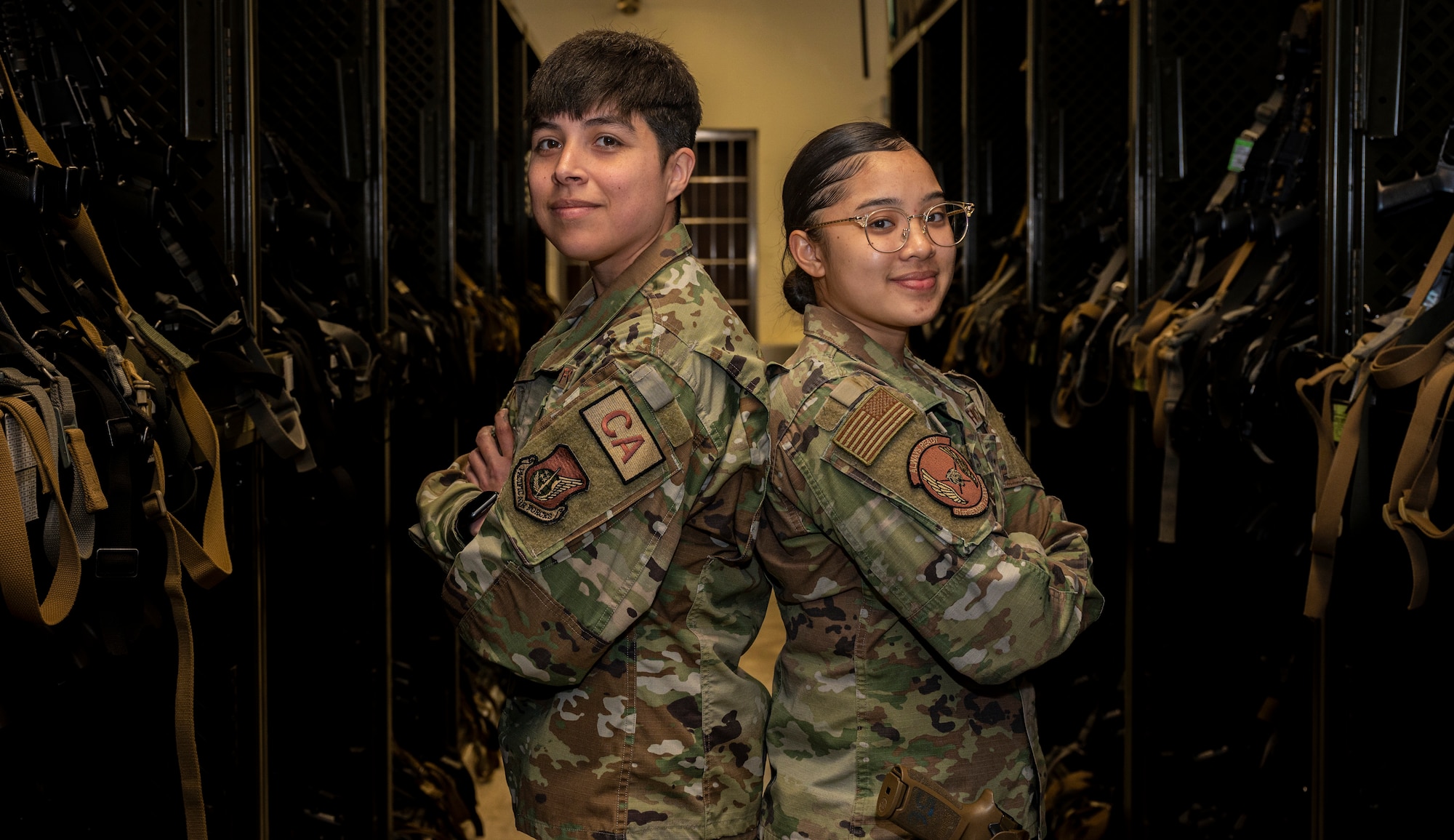 U.S. Air Force Staff Sgt. Glenda Francis (left), 51st Security Forces Squadron, NCO in-charge of armory and Senior Airman Amron Barcinas, 51st SFS armorer, pose for a photo in celebration of Women’s History Month at Osan Air Base, Republic of Korea, March 27, 2023.
