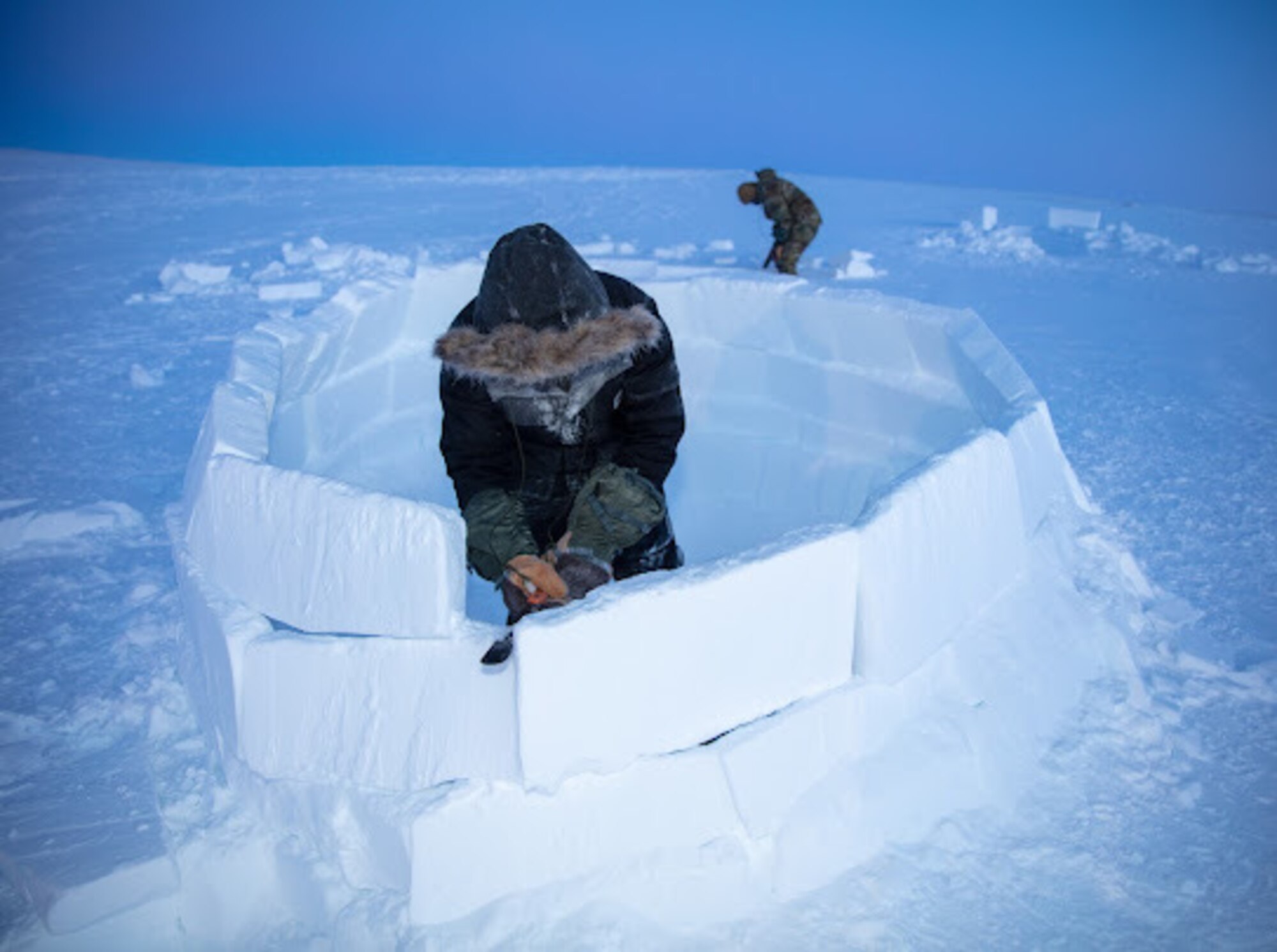 U.S. Air Force Master Sgt. Cody Hallas, 133rd Contingency Response Team, builds an Igloo in Crystal City, Canada.