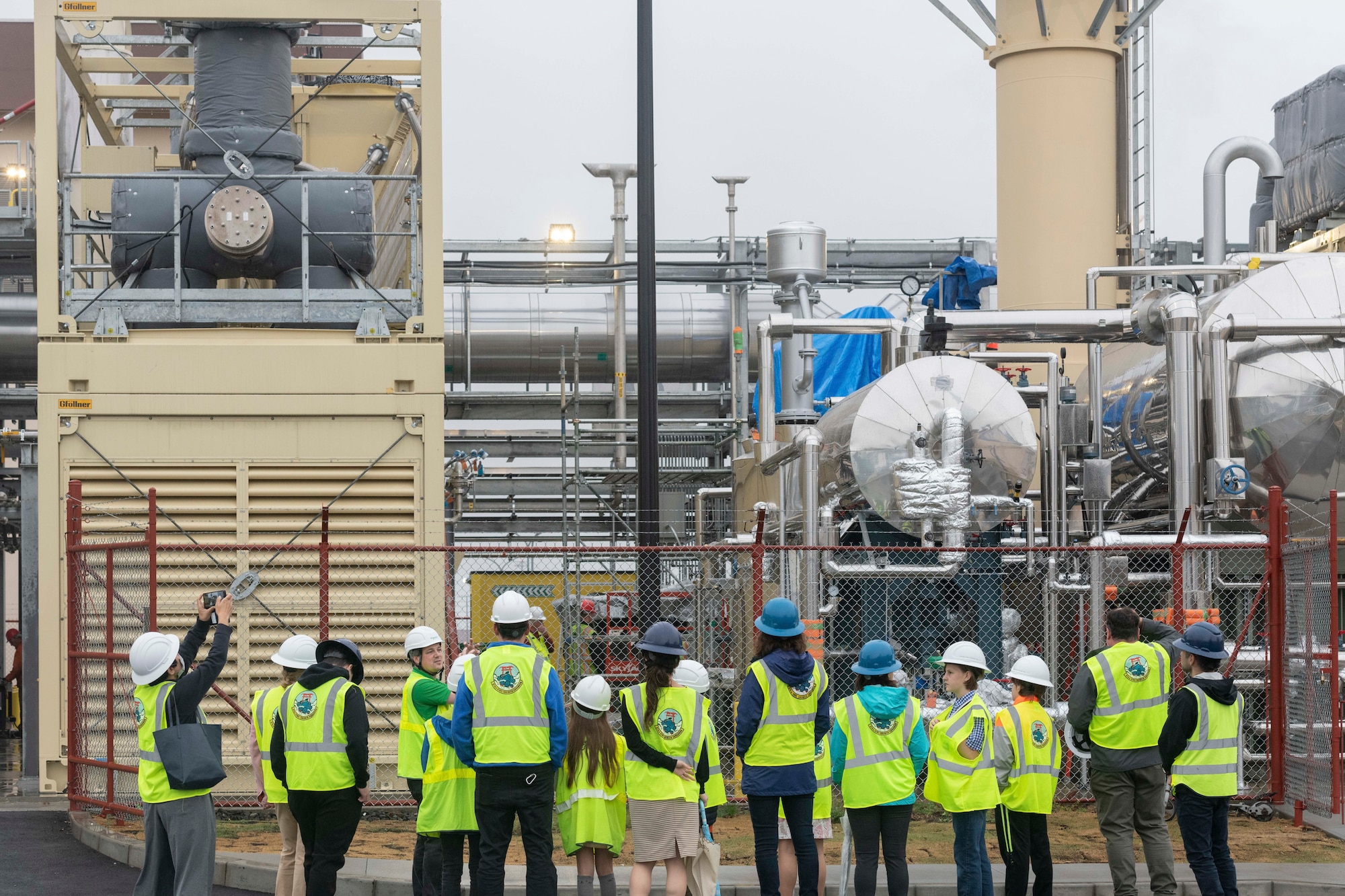 Nick Canton, Schneider Electric energy manager, briefs participants about the structure of the Combined Heating and Power (CHP) plant at Yokota Air Base, Japan, March 23, 2023.