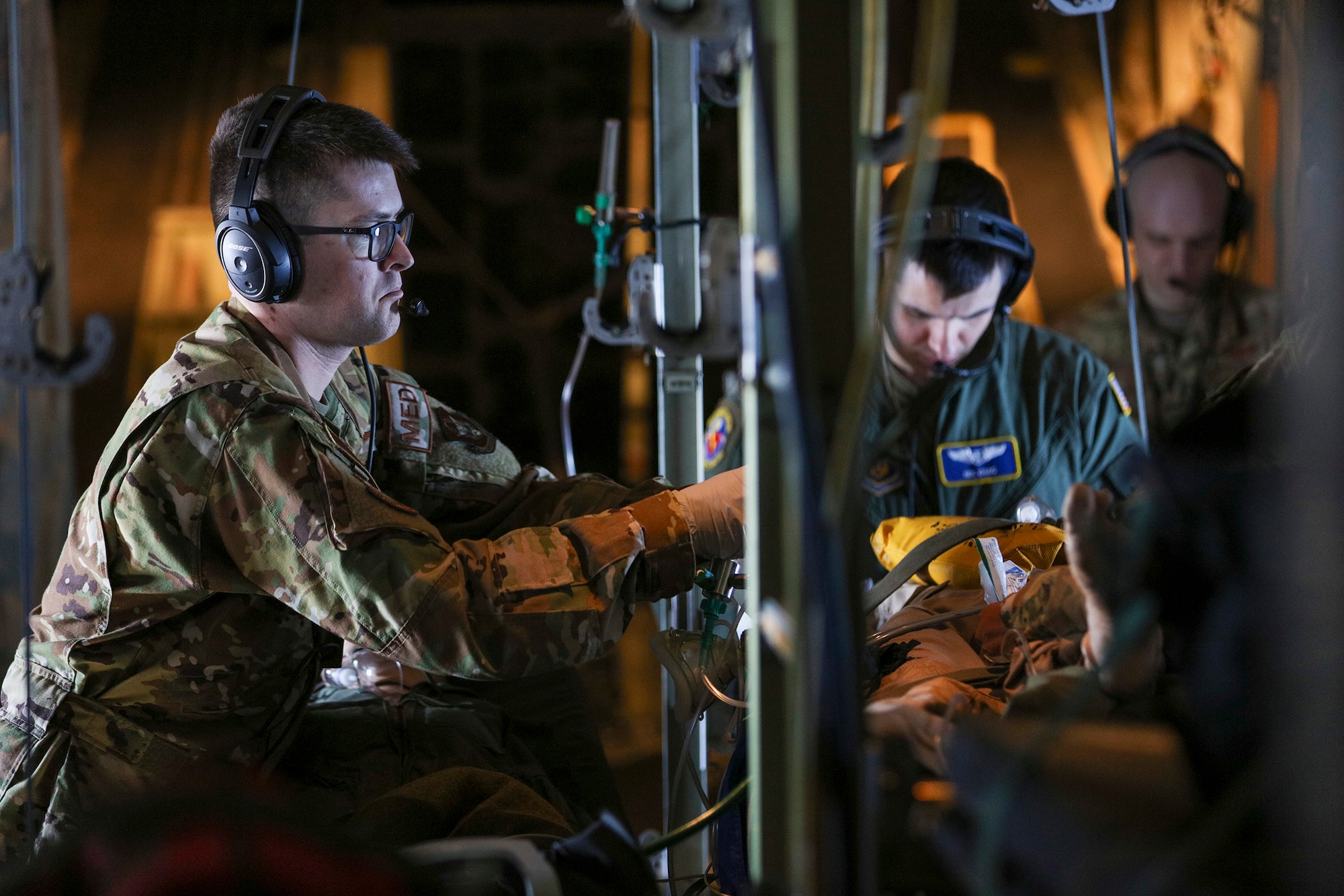 Staff Sgt. Trey Naber, 445th Aeromedical Evacuation Squadron medical technician, and his fellow squadron teammates check the vitals on a mock "patient" on board a C-130J Hercules during Dissimilar Aircraft Refresher Training (DART) at Keesler Air Force Base, Miss. March 21, 2023. Naber and five other AES reservists which were enroute to train at St. Croix, U.S. Virgin Islands, March 21 – 23, 2023.