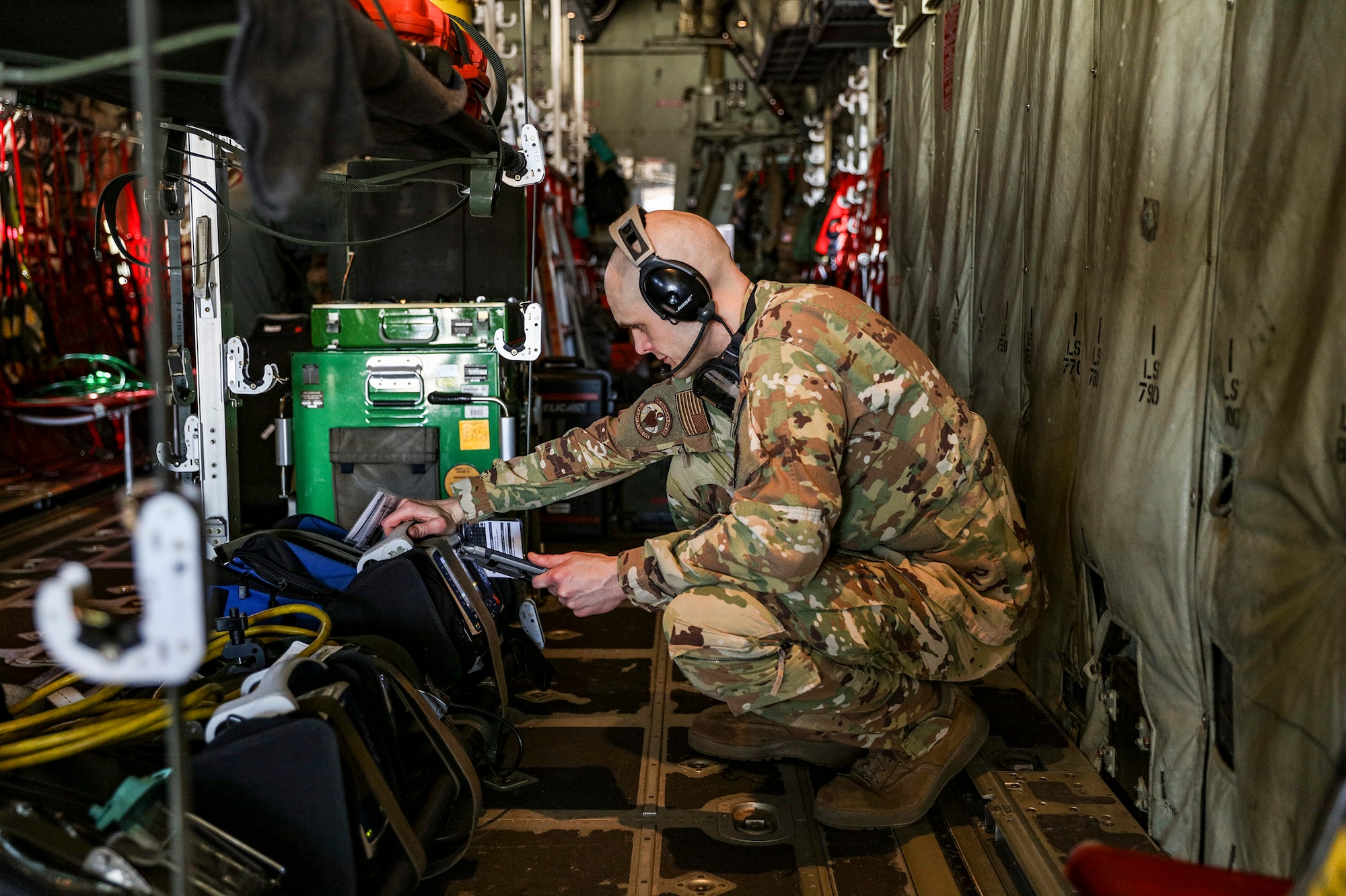 Master Sgt. Brandon High, 445th Aeromedical Evacuation Squadron medical technician, checks pre-flight equipment prior to take off on a C-130J Hercules during Dissimilar Aircraft Refresher Training (DART) at Keesler Air Force Base, Miss. March 21, 2023. High was among six reservists assigned to the 445th AES that were enroute to train at St. Croix, U.S. Virgin Islands, March 21 – 23, 2023.