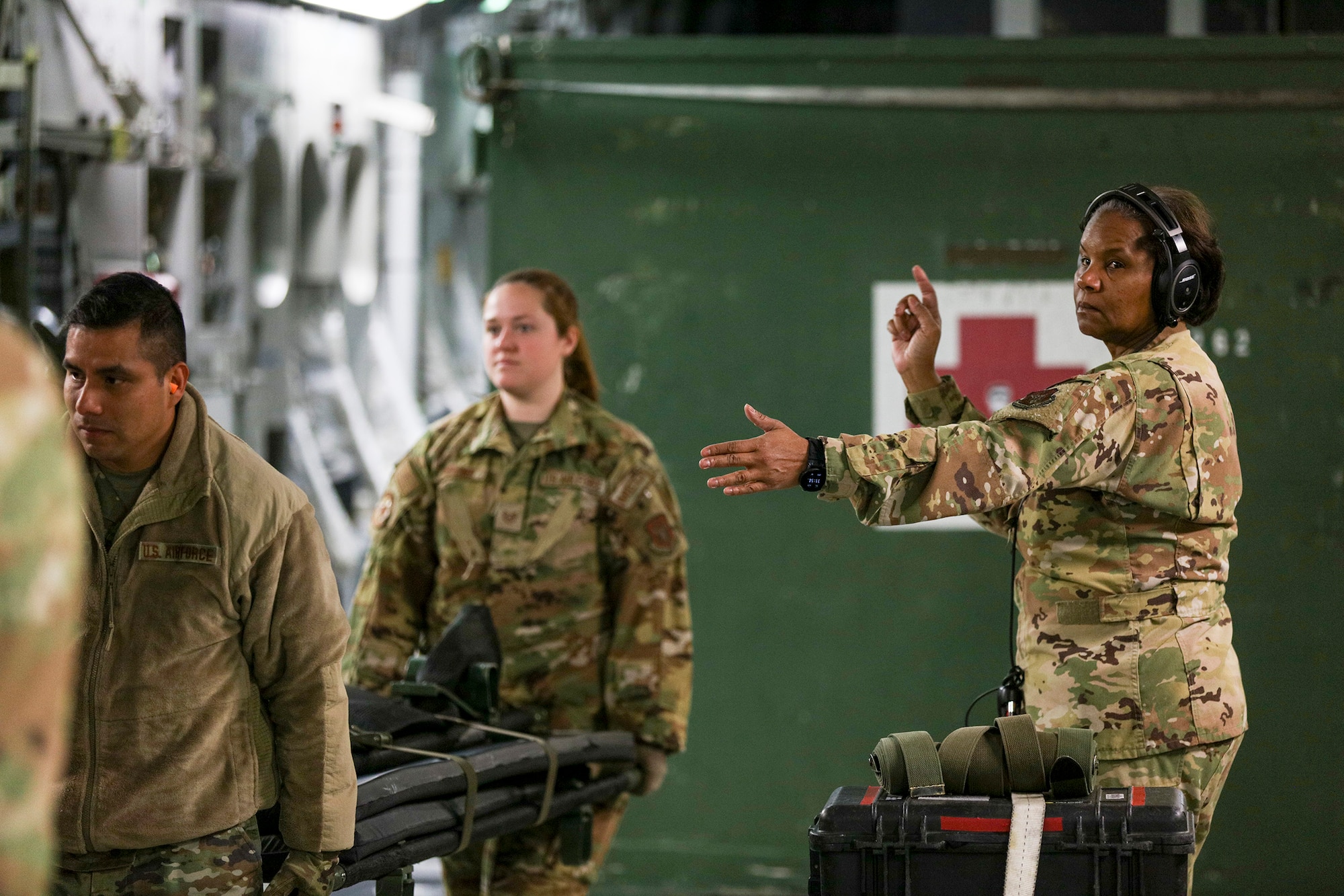 Lt. Col. Jenice Brown, 445th Aeromedical Evacuation Squadron flight nurse, directs 445th AES members on-loading equipment prior to take off on a 445th Airlift Wing C-17 Globemaster III, March 21, 2023 at Wright-Patterson Air Force Base, Ohio. Six reservists assigned to the 445th AES participated in Dissimilar Aircraft Refresher Training (DART) at St. Croix, U.S. Virgin Islands, March 21 – 23, 2023.  (U.S. Air Force photo/Master Sgt. Patrick O’Reilly)