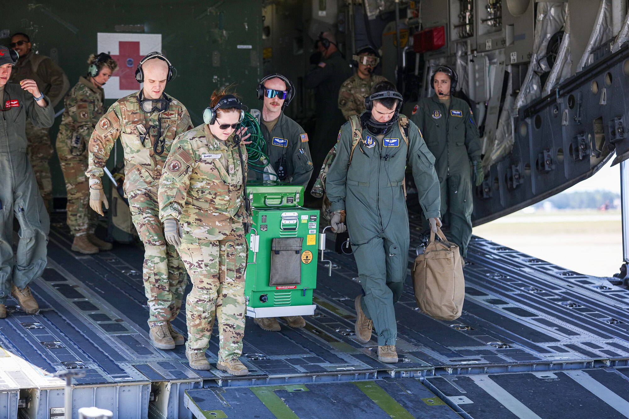 Members of the 445th Aeromedical Evacuation Squadron off-load a Next Generation Portable Therapeutic Liquid Oxygen System (NPTLOX) from a 445th Airlift Wing C-17 Globemaster III during Dissimilar Aircraft Refresher Training (DART) at Keesler Air Force Base, Miss. March 21, 2023. They were among six reservists assigned to the 445th AES which were enroute to train at St. Croix, U.S. Virgin Islands, March 21 – 23, 2023.