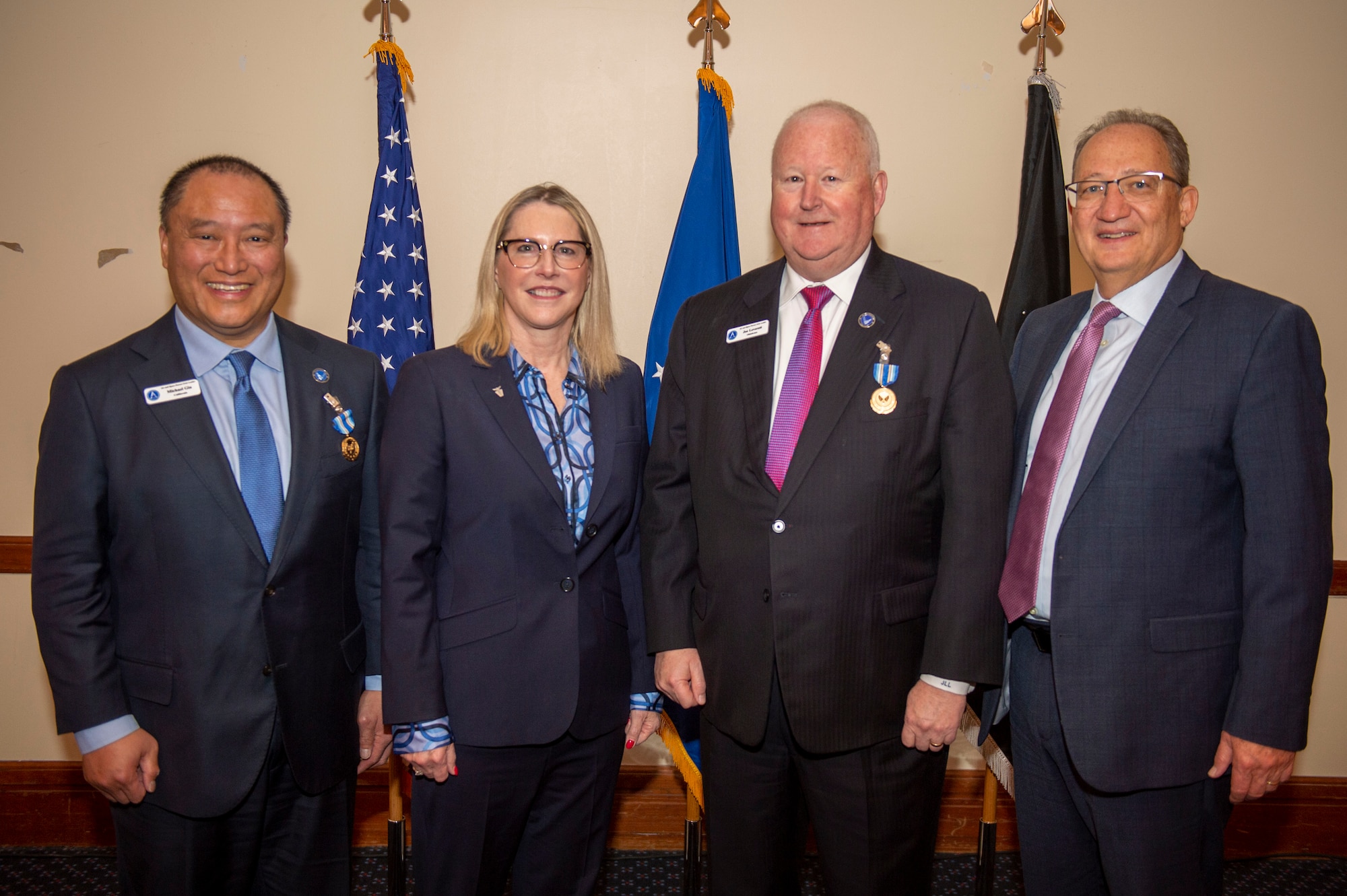 (From left) Michael Gin, Dr. Lisa Costa, the U.S. Space Force Chief Technology and Innovation Officer, Dr. Joe Leverett and Mr. Jerry Renne, director, U.S. Air Force Public Affairs, pause for a photo during an Air Force and Space Force civic leader award ceremony at Andrews Air Force Base, Md., March 9, 2023. Civic leaders from the Air and Space Forces were recognized for their achievements, and a new class of leaders were inducted to represent Airmen and Guardians in their local areas. (U.S. Air Force photo by Staff Sgt. Adam R. Shanks)