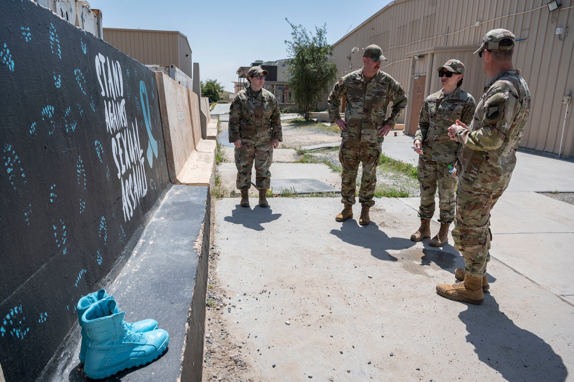 U.S. Air Force Capt. Rebekah Morris, the 386th Air Expeditionary Wing sexual assault response coordinator, talks to Wing leadership about the importance of Sexual Assault Awareness and Prevention Month at Ali Al Salem Air Base, Kuwait, March 27, 2023.