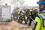 Service members from participating nations and members of the Humanitarian Assistance Disaster Relief Institute demonstrate a collapsed building rescue during Exercise Cobra Gold 2023 at the Disaster Relief Training Center in Chachoengsao province, Kingdom of Thailand, March 4, 2023. At the demonstration leaders from participating nations discussed how their nations can combine capabilities in response to regional crises.