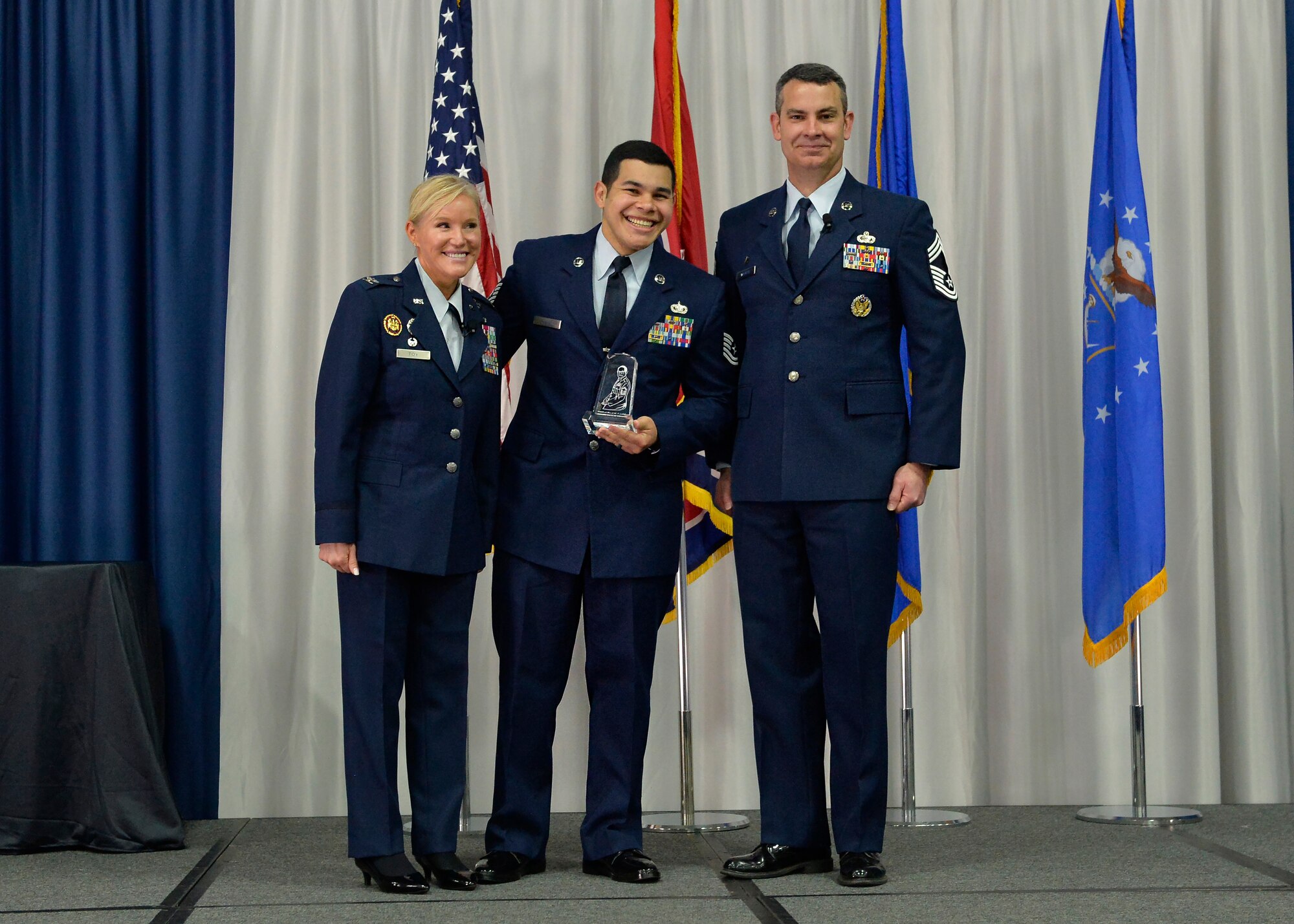 Airman receives an award during graduation.