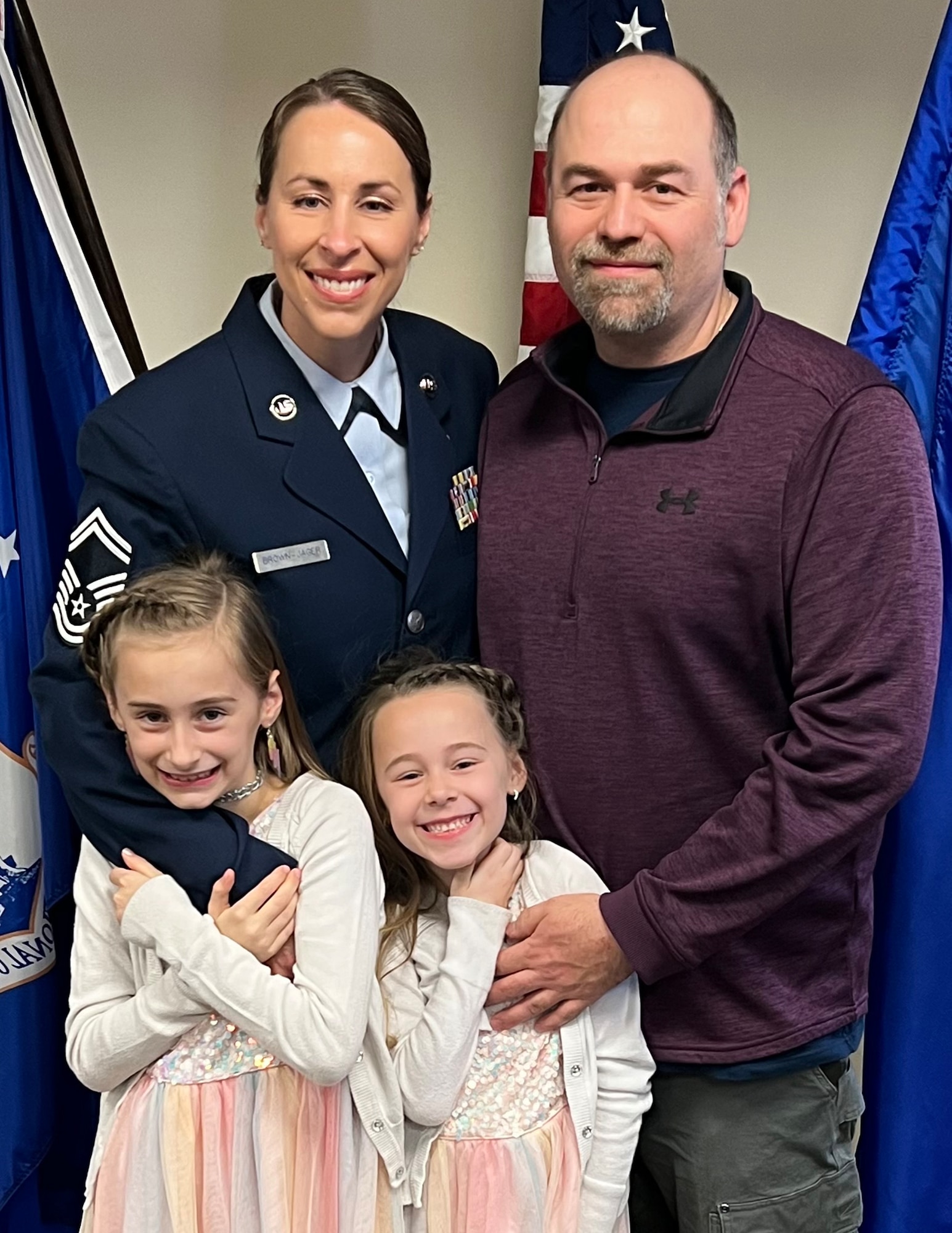 U.S. Air Force Senior Master Sgt. Sarah Brown-Jager poses for a photo with her family in St. Paul, Minn., Feb. 15, 2022.