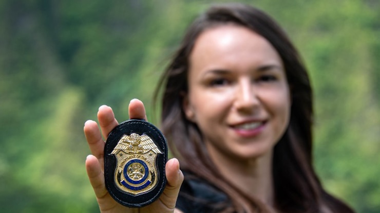 Army CID agent showing her Special Agent badge