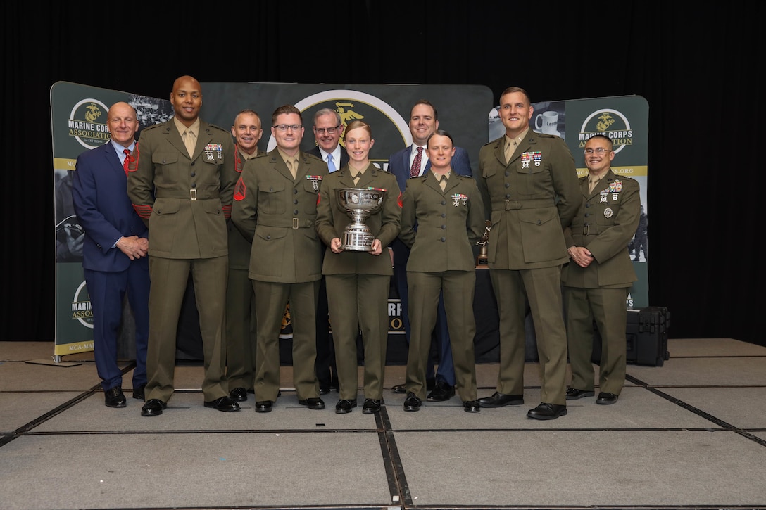 U.S. Marines with 11th Marine Expeditionary Unit, I Marine Expeditionary Force (I MEF) accept the Intelligence Unit of the Year Award in Arlington, Virginia, April 14, 2022. The third annual Marine Corps Association (MCA) Information Awards Dinner, administered by the Deputy Commandant for Information (DC I), recognized 16 individual awards and 3 unit awards chosen from information communities including Intelligence, Command, Control, Communications and Computers (C4), Cyber, Psychological Operations (PSYOP), Space, Electromagnetic Spectrum Operations, Communication Strategy and Operations (COMMSTRAT) and Civil Affairs (CA). (U.S. Marine Corps photo by Lance Cpl. Christine Phelps)