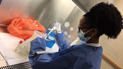 Army CID DNA Examiner, prepares COVID-19 samples for testing