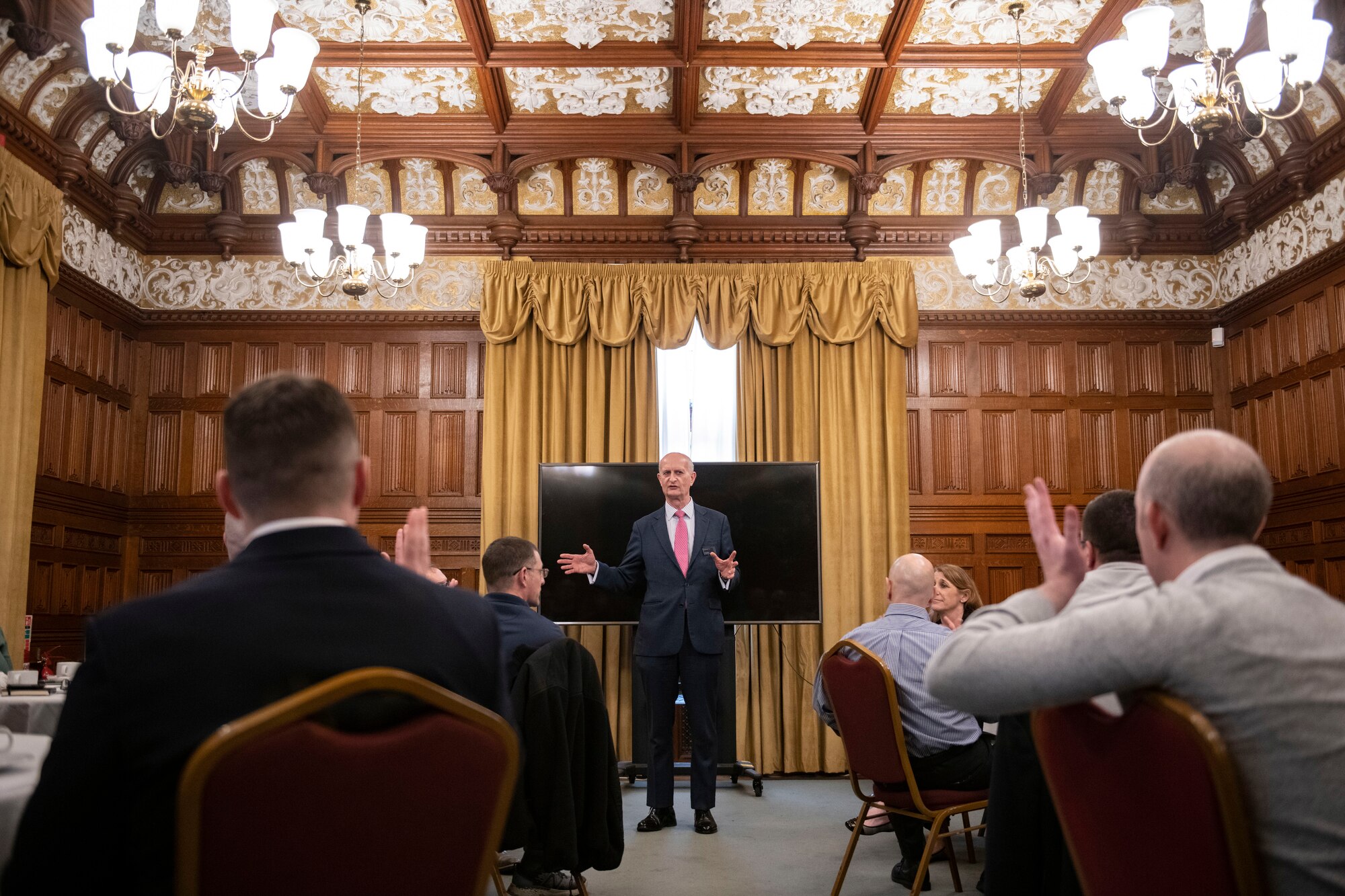 Iain Standen, Bletchley Park Trust CEO, center, addresses 501st Combat Support Wing leadership at Bletchley Park