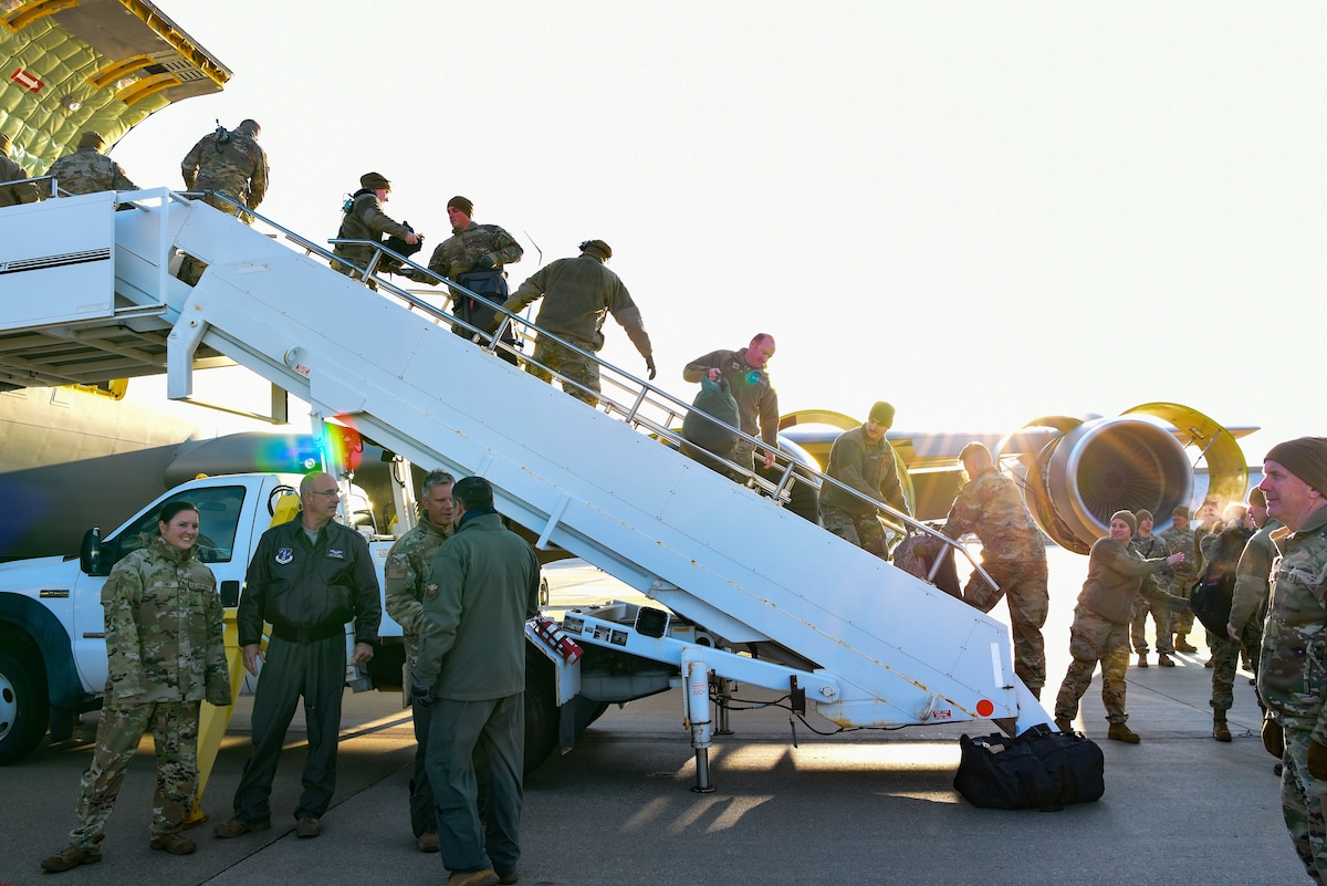 128th Air Refueling Wing Airmen unload their gear from a KC-135 after returning home from deployment here at General Mitchell Field, Milwaukee, WI, March 5, 2023. Airmen from the 128th ARW were assigned to the 506th Expeditionary Air Refueling Squadron as part of the U.S. Pacific Command at Andersen Air Force Base, Guam. (U.S. Air National Guard photo by Airman Cynthia Yang)