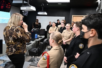 DAHLGREN, Va. (March 28, 2023) Surface Combat Systems Training Command (SCSTC) AEGIS Training and Readiness Center’s (ATRC) Director of Training Readiness, Mrs. Amanda Blackman, illustrates the many capabilities of the Reconfigurable Combat Information Center Trainer (RCT) to cadets and instructors from Stafford High School’s Navy Junior Reserve Officer's Training Corps (NJROTC) during their visit to Naval Support Facility Dahlgren, March 28.  The RCT is part of the Director, Surface Warfare’s (OPNAV N96) program of record, Surface Training Advanced Virtual Environment-Combat Systems (STAVE-CS), which was introduced in 2015 as a means to invest in training technologies, devices, and facilities to improve the effectiveness, efficiency, and availability of all surface training.