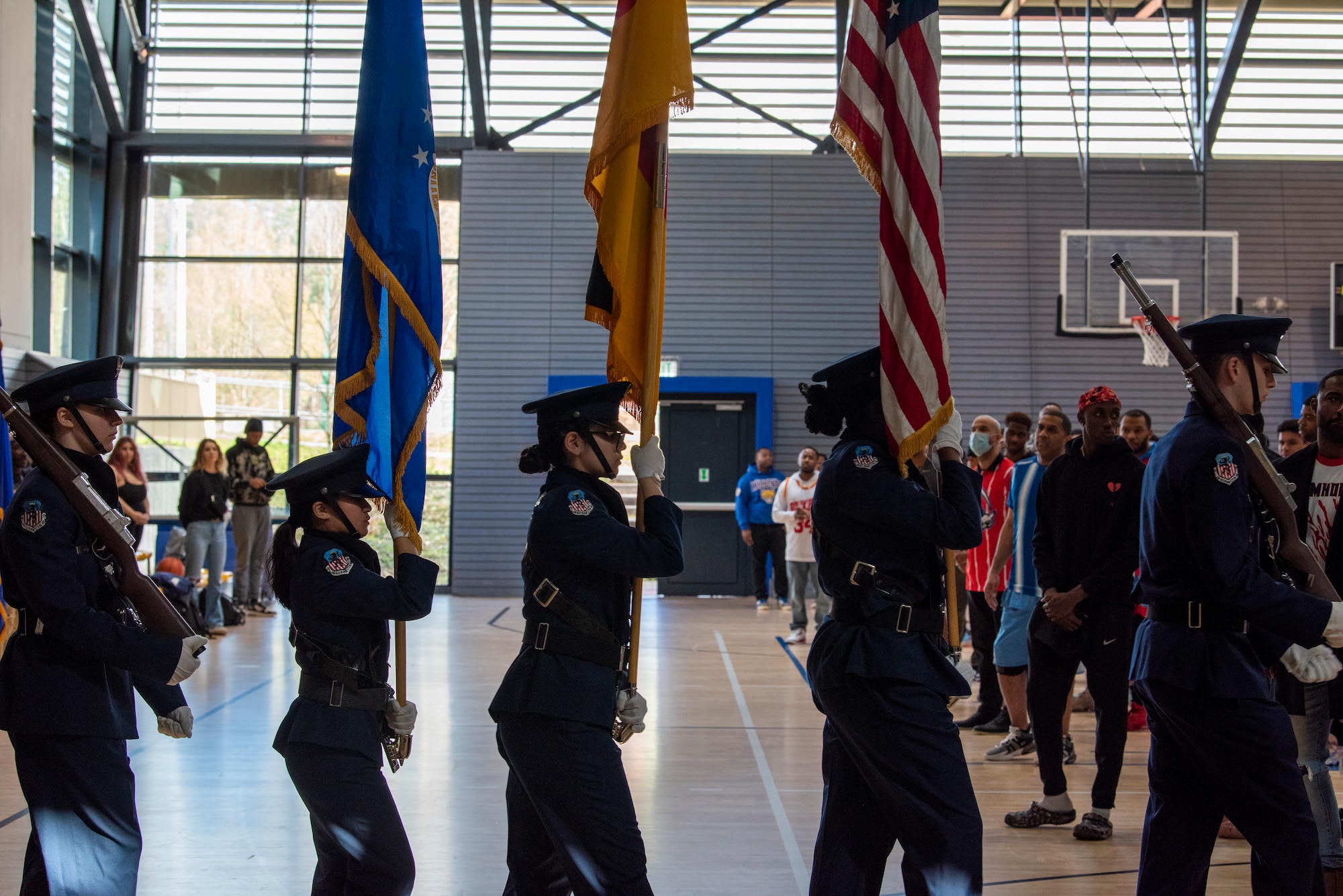 Color Guard carries flags during ceremony.
