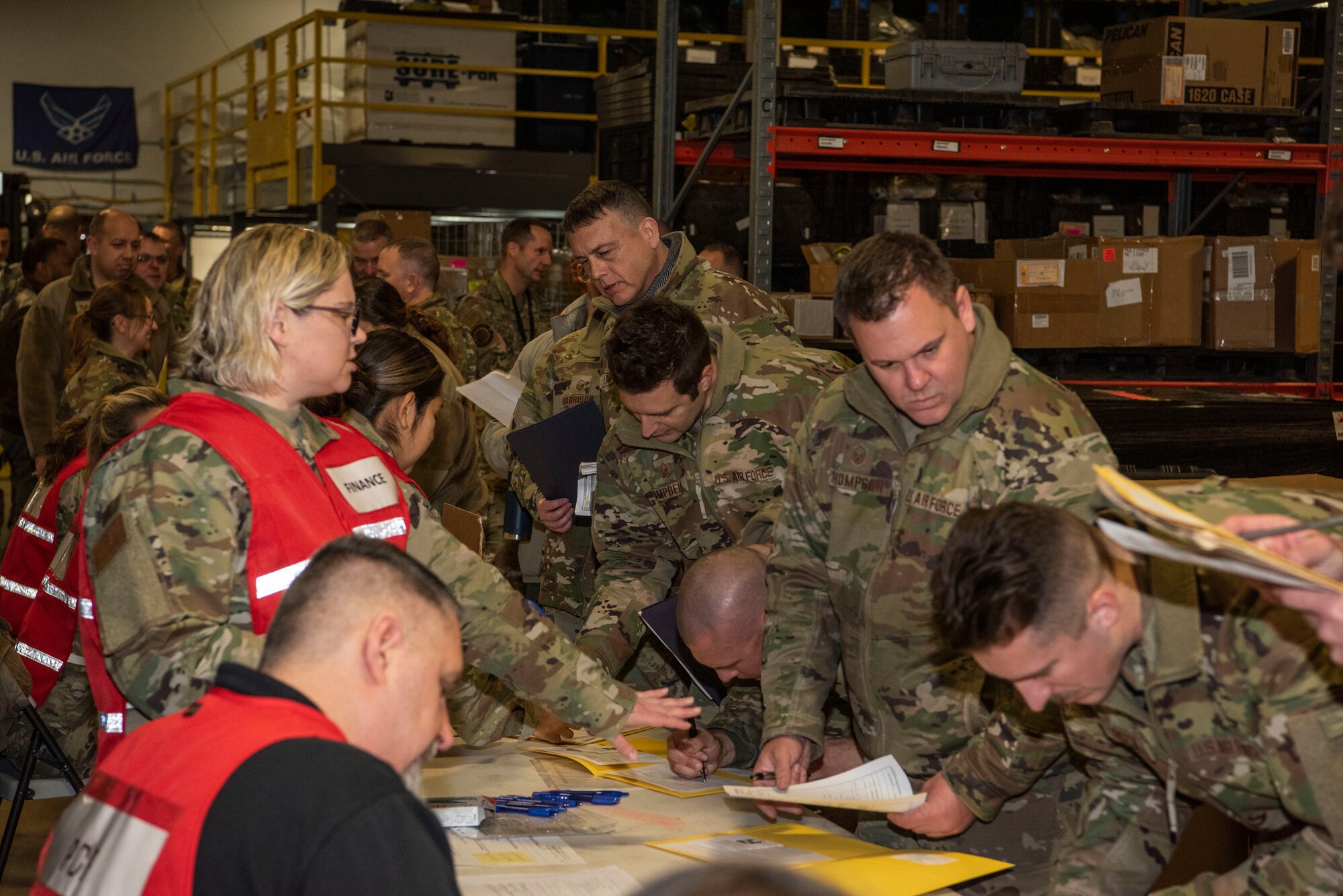 A 128th Air Refueling Wing Airmen process through the personnel deployment function as they prepare for an upcoming deployment here at General Mitchell Field, Milwaukee, WI, Dec. 21, 2022. Airmen from the 128th ARW will be assigned to the 506th Expeditionary Air Refueling Squadron as part of the U.S. Pacific Command at Andersen Air Force Base, Guam. (U.S. Air National Guard photo by Master Sgt. Kellen Kroening)