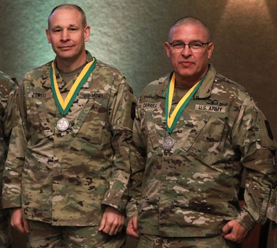 Col. Justin Towell, Commander of the 404th Maneuver Enhancement Brigade, and Command Sgt. Maj. Richard Carroll, the brigade's command sergeant major, were both awarded the Military Police Regimental Association’s Order of the Marechaussee.