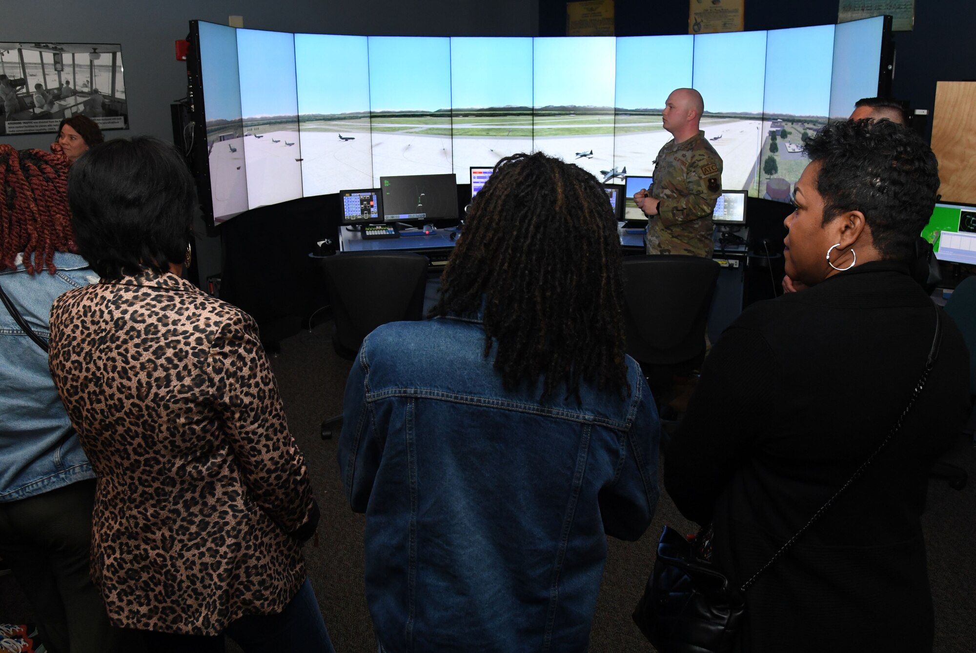 U.S. Air Force Staff Sgt. James Whitney, 334th Training Squadron instructor, provides an air traffic control tower simulator demonstration to members of the Association for Career and Technical Education inside Cody Hall at Keesler Air Force Base, Mississippi, March 29, 2023.