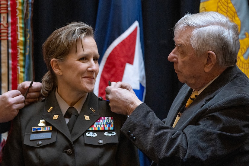Alan Stohle, right, pins one-star rank on his daughter, Brig. Gen. Paige M. Jennings, U.S. Army Financial Management Command commanding general, during her promotion ceremony at the Indiana Statehouse in Indianapolis Feb. 17, 2023. Jennings, a native of Missoula, Montana, began her military career in 1995 after commissioning into the Finance Corps as a distinguished military graduate of the University of Montana’s Grizzly Battalion Army Reserve Officer Training Corps program. (U.S. Army photo by Mark R. W. Orders-Woempner)