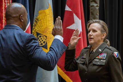 Retired U.S. Army Brig. Gen. Omuso George, left, administers the Oath of Office to Brig. Gen. Paige M. Jennings, U.S. Army Financial Management Command commanding general, during her promotion ceremony at the Indiana Statehouse in Indianapolis Feb. 17, 2023. Jennings, a native of Missoula, Montana, began her military career in 1995 after commissioning into the Finance Corps as a distinguished military graduate of the University of Montana’s Grizzly Battalion Army Reserve Officer Training Corps program. (U.S. Army photo by Mark R. W. Orders-Woempner)