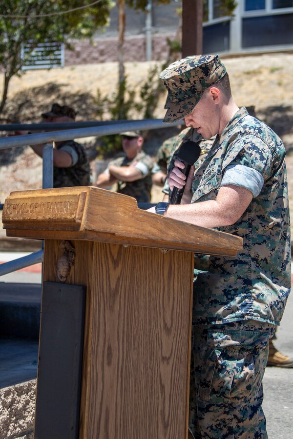 U.S. Marine Corps Staff Sgt. Jessica Stegeman, a career planner with the School of Infantry - West, narrates during a change of command ceremony at SOI-West, Marine Corps Base Camp Pendleton, California, June 24, 2022. During the ceremony, Col. Coby Moran relinquished command of SOI-West to Col. Seth MacCutcheon. Stegeman is a native of Cincinnati. (U.S. Marine Corps photo by Cpl. Alison Dostie)