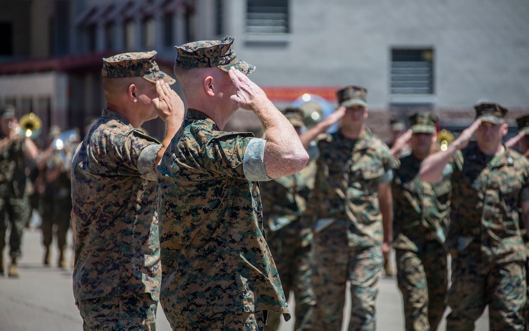 U.S. Marine Corps Col. Coby Moran, left, the outgoing commanding officer of the School of Infantry - West, and Col. Seth MacCutcheon, the incoming commanding officer of SOI-West, salute during a change of command ceremony at SOI-West on Marine Corps Base Camp Pendleton, California, June 24, 2022. Moran reported to SOI-West in July of 2020. MacCutcheon is reporting from U.S. Marine Forces Pacific. Moran is a native of Seattle; MacCutcheon is a native of Fort Lauderdale, Florida. (U.S. Marine Corps photo by Cpl. Alison Dostie)