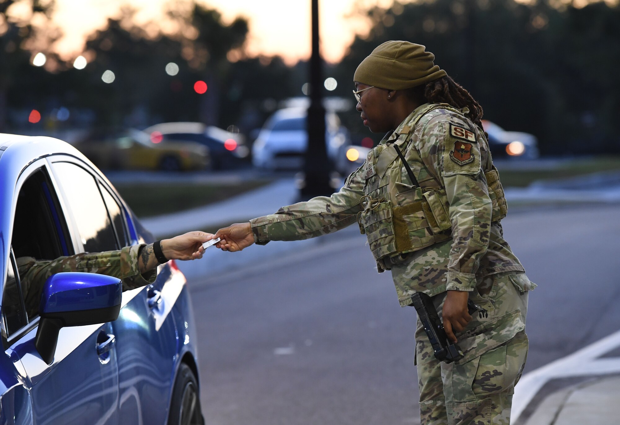 U.S. Air Force Senior Airman Jocilyn Carver, 81st Security Forces Squadron entry controller, conducts an ID check at the Division Street Gate during an All-Female Flight work day at Keesler Air Force Base, Mississippi, March 30, 2023.