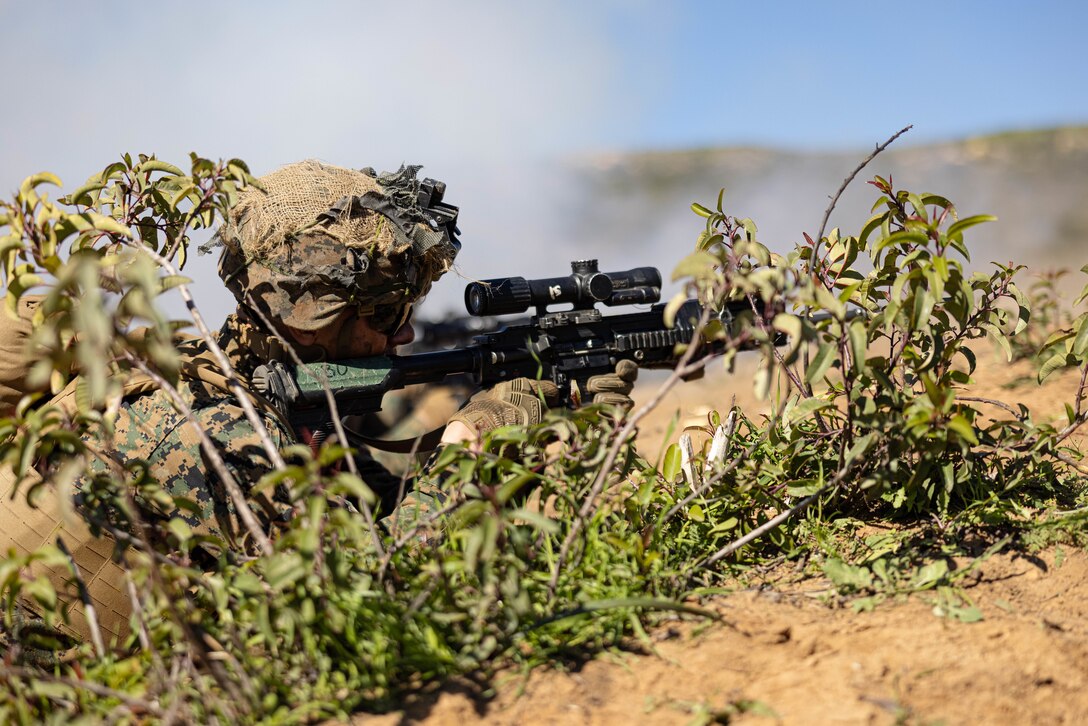 A U.S. Marine with Infantry Marine Course 2-23, Infantry Training Battalion, School of Infantry-West, engages targets during a fire and maneuver range at Marine Corps Base Camp Pendleton, California, Jan. 24, 2023. IMC is the Marine Corps’ 14-week entry-level training course for enlisted infantry Marines. (U.S. Marine Corps photo by Cpl. Willow Marshall)