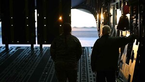 U.S. Air Force Staff Sgt. Lacy Pickett, 56th Air Refueling Squadron boom operator, lowers the ramp on a C-17 Globemaster III while standing next to Tech. Sgt. Ashley McGill, 58th Airlift Squadron loadmaster instructor at Altus Air Force Base, March 28, 2023. Women make up less than 10 percent of the boom operator and loadmaster career fields. (U.S. Air Force photo by Airman 1st Class Kari Degraffenreed)