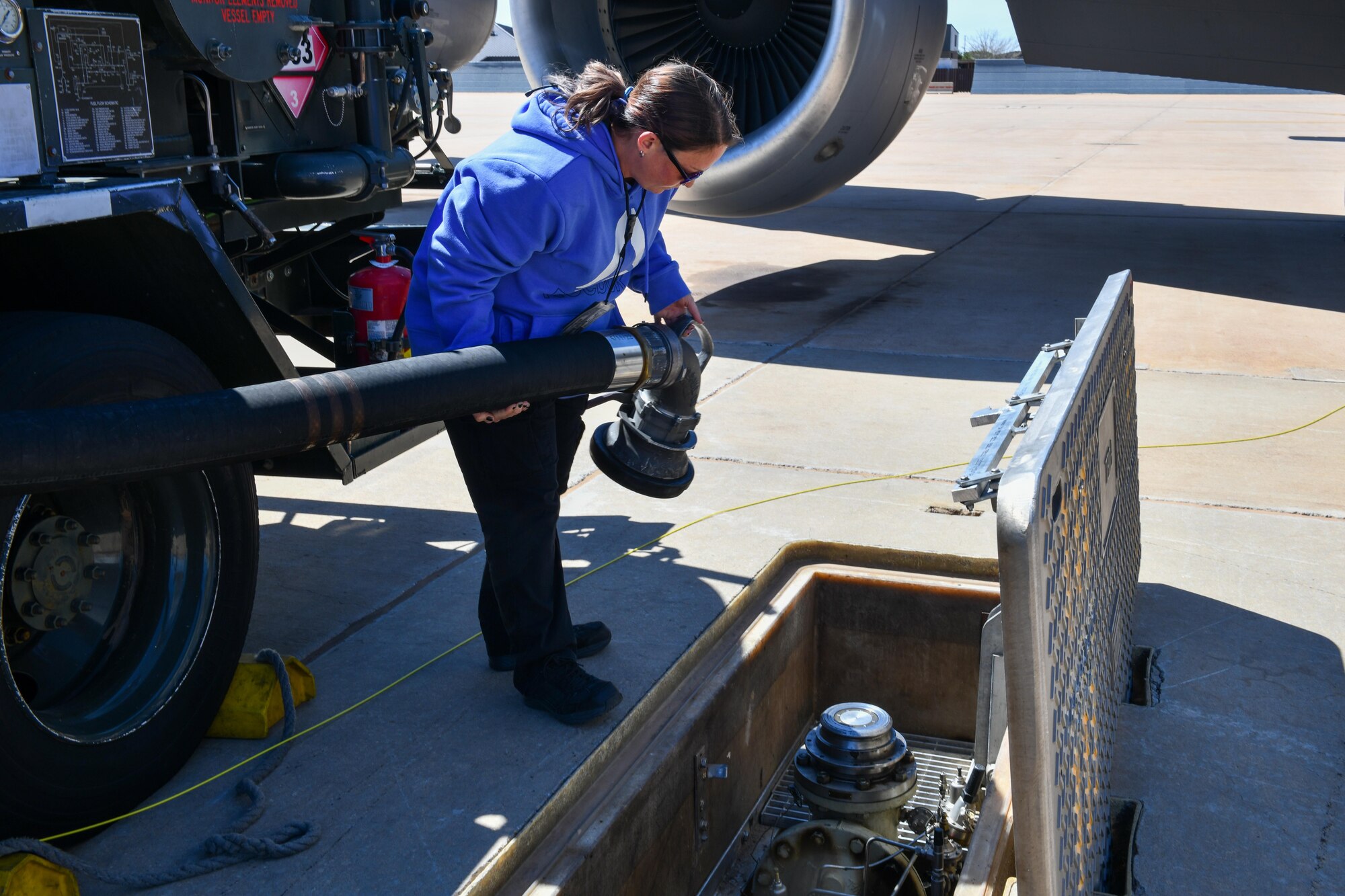 Theresa Baugher, 97th Logistics Readiness Squadron fuel systems operator, attaches a fuel line at Altus Air Force Base (AFB), Oklahoma, March 28, 2023. Altus AFB’s fuels management flight oversees the distribution of more than 40 million gallons of fuel annually. (U.S. Air Force photo by Airman 1st Class Miyah Gray)