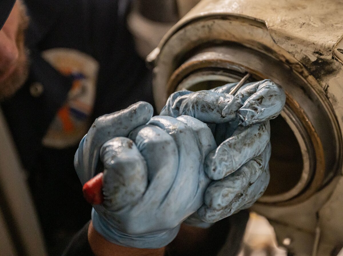Anthony Porreca, 512th Maintenance Squadron Aero Repair work lead, performs maintenance during a C-5M Super Galaxy main landing gear installation at the 436th MXS Isochronal Dock on Dover Air Force Base, Delaware, March 24, 2023. The 436th MXS Isochronal Dock is capable of performing certain Programmed Depot Maintenance-level jobs, effectively minimizing maintenance downtime and increasing aircraft availability. (U.S. Air Force photo by Senior Airman Cydney Lee)