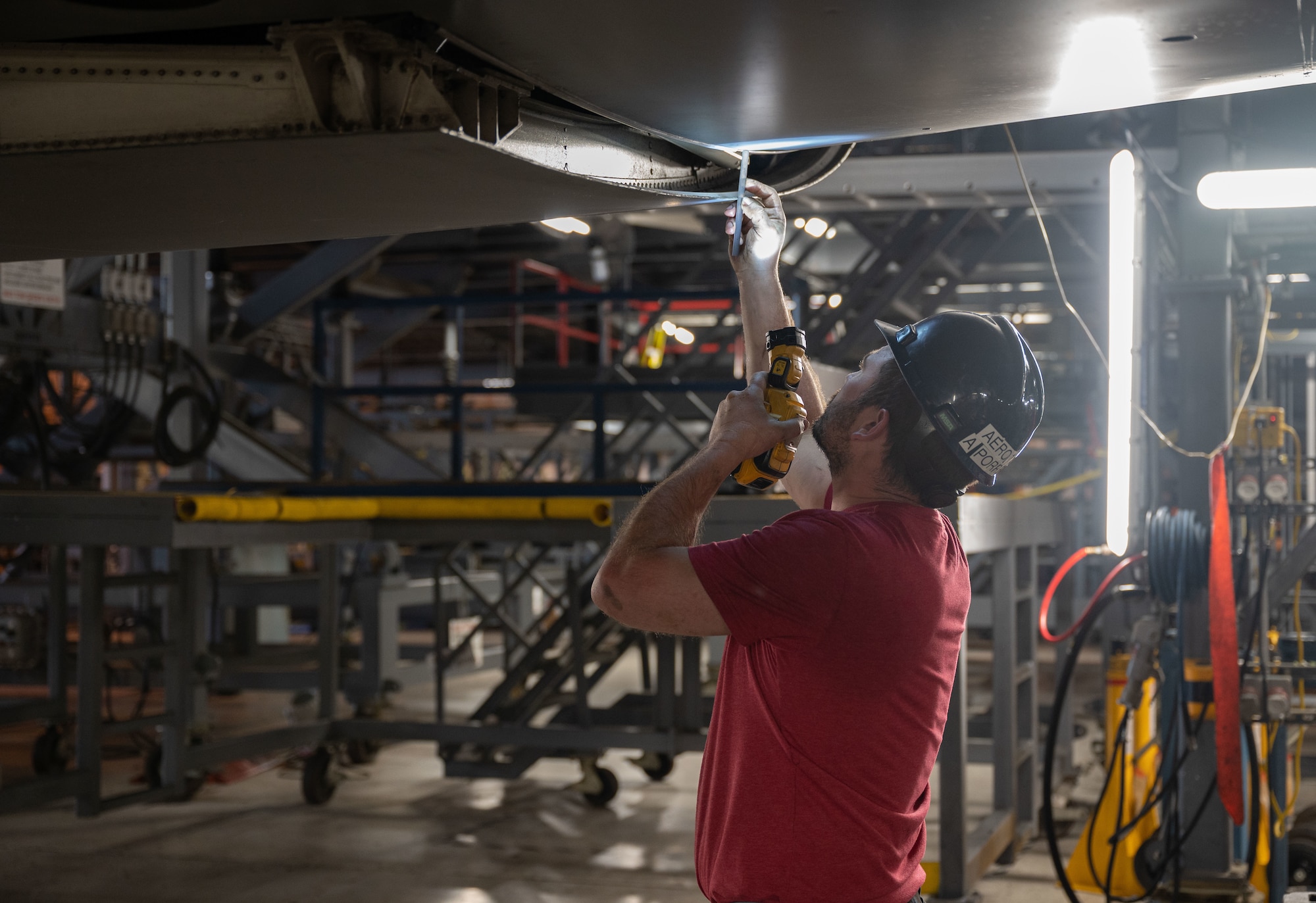 Anthony Porreca, 512th Maintenance Squadron Aero Repair work lead, inspects main landing gear rigging on a C-5M Super Galaxy at the 436th MXS Isochronal Dock on Dover Air Force Base, Delaware, March 24, 2023. The 436th MXS Isochronal Dock is capable of performing certain Programmed Depot Maintenance-level jobs, effectively minimizing maintenance downtime and increasing aircraft availability. (U.S. Air Force photo by Senior Airman Cydney Lee)