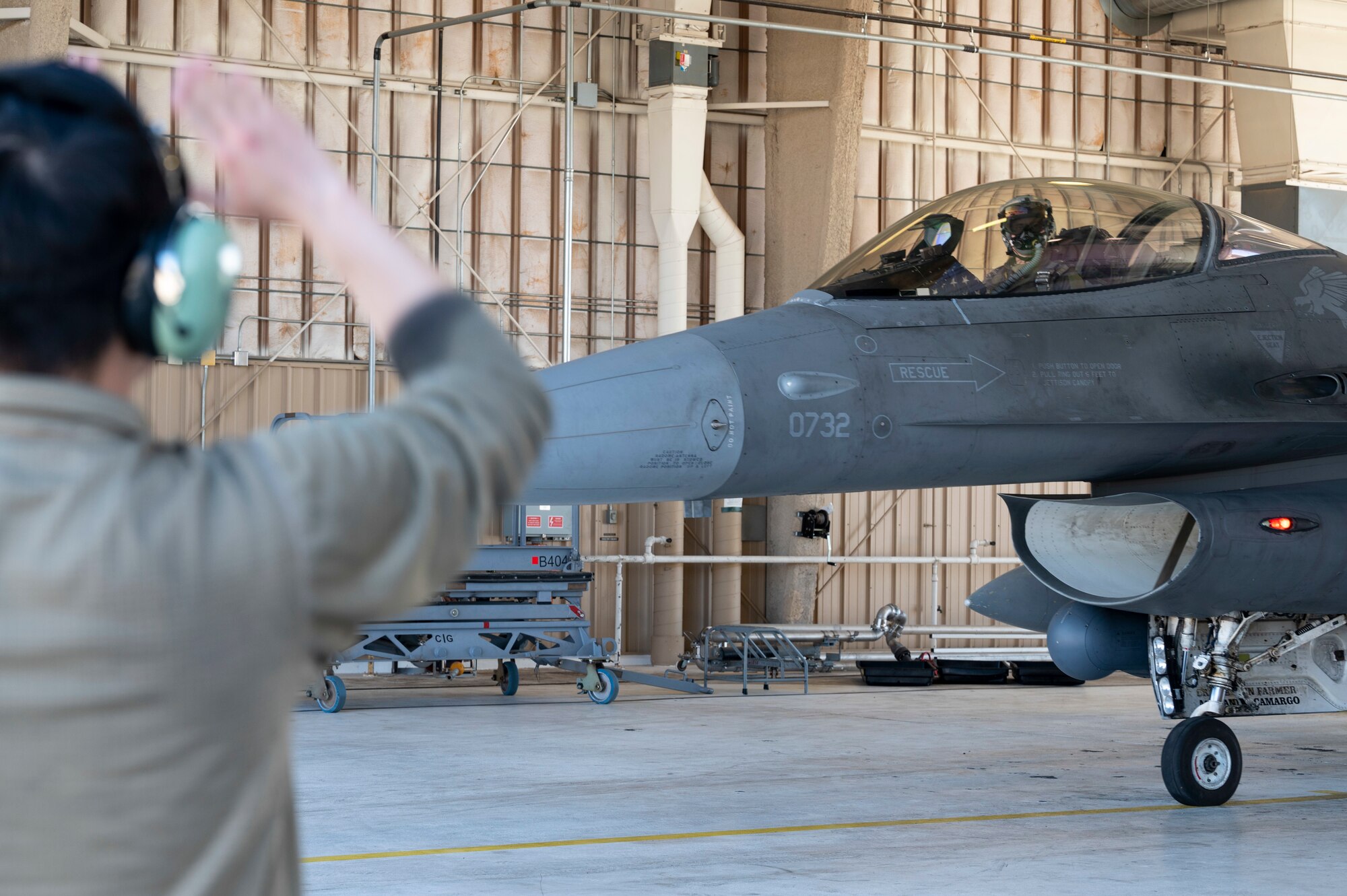 U.S. Air Force Maj. Matthew Jerrell, 314th Fighter Squadron instructor pilot, gets marshaled out of a hangar at Holloman Air Force Base, New Mexico, March 27, 2023.