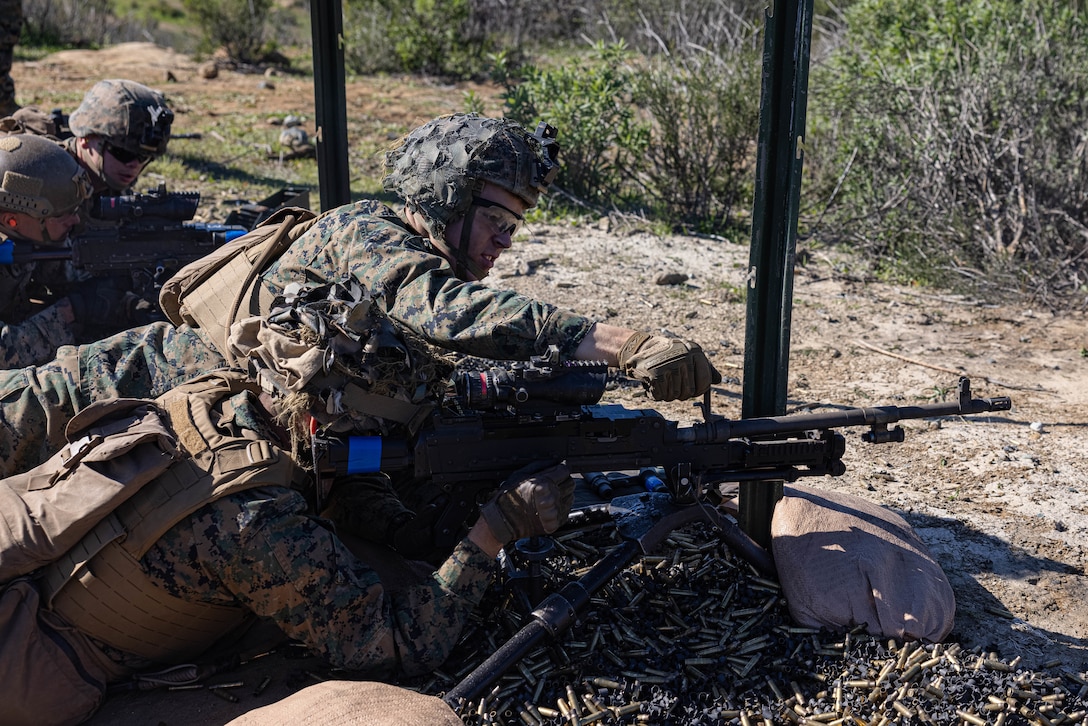 U.S. Marine, Pfc. Connor Napper, a student with Infantry Marine Course 2-23, Infantry Training Battalion, School of Infantry-West, changes the barrel of an M240B medium machine gun during a fire and maneuver range at Marine Corps Base Camp Pendleton, California, Jan. 24, 2023. IMC is the Marine Corps’ 14-week entry-level training course for enlisted infantry Marines. Napper is a native of Kimberly, Wisconsin. (U.S. Marine Corps photo by Cpl. Willow Marshall)