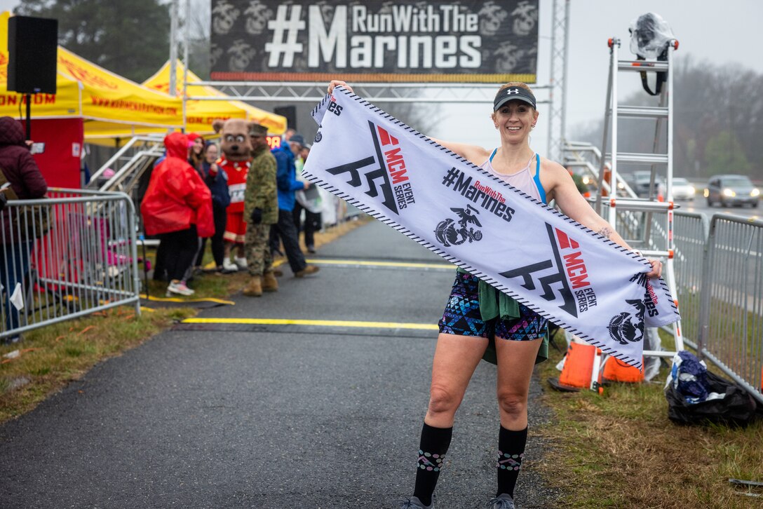 Erin-Kate Aleksak crosses the finish line of the Marine Corps Marathon 17.75k at Prince William Forest
Park, Virginia, March 25, 2023. The 17.75k distance commemorates the year the Marine Corps was
established and offers finishers “Access Granted” passes, granting them guaranteed access into the 48th
MCM. (U.S. Marine Corps photo by Lance Cpl. Joaquin Dela Torre)