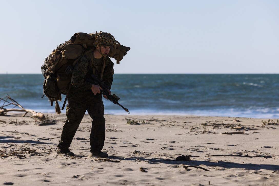 U.S. Marine Pfc. Anders Pouliot, a student with Infantry Marine Course 1-23, Infantry Training Battalion, School of Infantry - West, begin a five-day final exercise covering 65 km after an amphibious insert at the Del Mar Boat Basin on Marine Corps Base Camp Pendleton, California, Jan. 23, 2023. IMC is the Marine Corps’ 14-week infantry training course designed to make better trained and more lethal entry-level Marines. Pouliot is a native of Aurora, Colorado. (U.S. Marine Corps photo by Lance Cpl. Earik Barton)