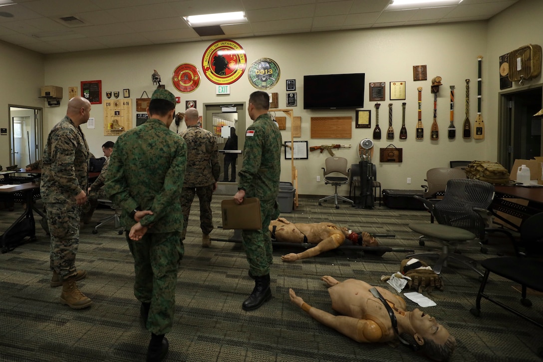 U.S. Marines escort Singapore Army soldiers through School of Infantry – West training facilities at Marine Corps Base Camp Pendleton, California, Feb. 2, 2023. The Marine Corps is dedicated to maintaining and developing its relationship with allied nations in the Pacific. (U.S. Marine Corps photo by Lance Cpl. Fred Garcia)