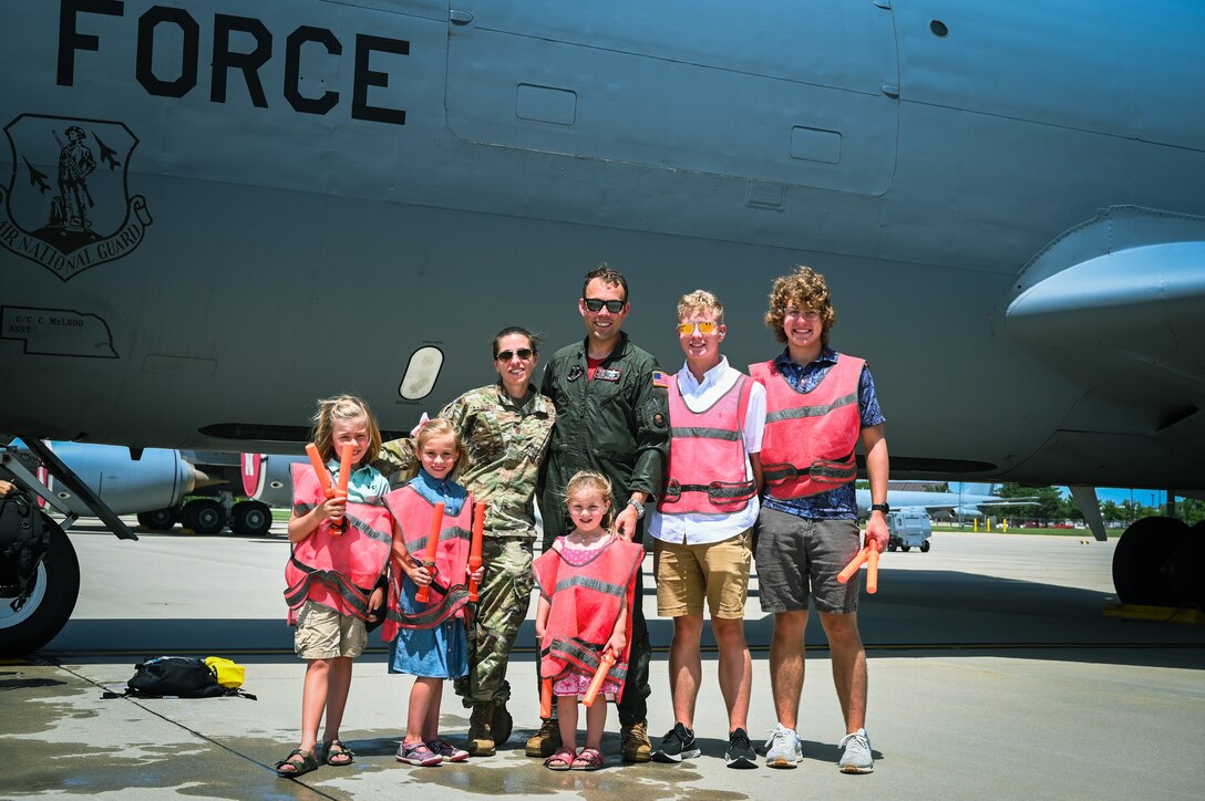 Lt. Col. Karl Duerk, 155th Air Refueling Wing pilot, poses with his family after fini-flight, June 17, 2022, at the Lincoln Air Force Base, Neb.