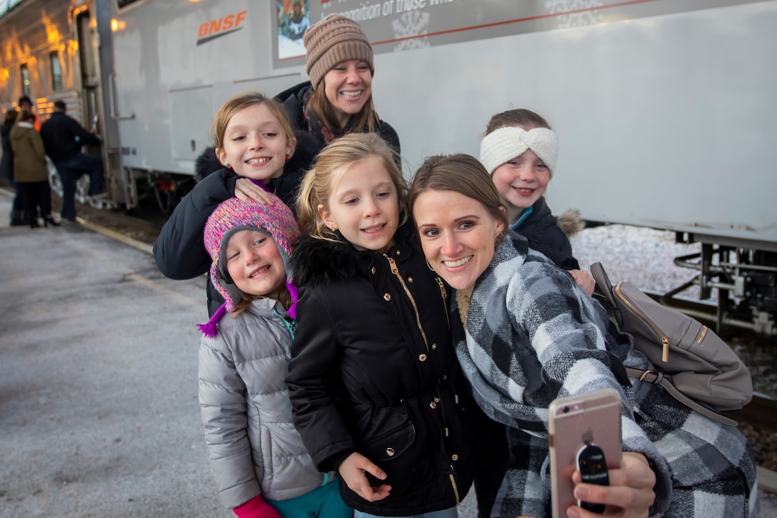 Around 350 Nebraska National Guard Soldiers, Airmen and their families took a ride on the Burlington Northern Santa Fe Holiday Express train, Nov. 28, from Omaha to Ashland and back