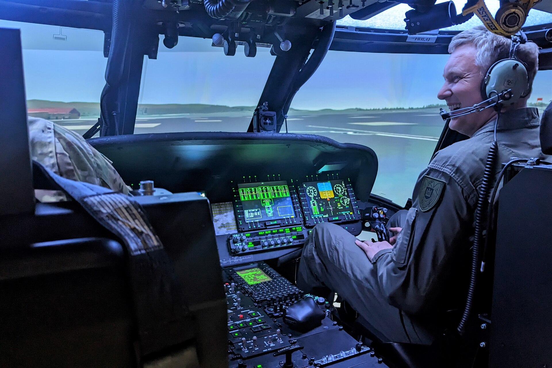 Col. Antanas Matutis, commander of the Lithuanian Air Force, receives an orientation and test drive of the Blackhawk Aircrew Trainer, a state-of-the-art rotary wing pilot simulator, at the Eastern Army National Guard Aviation Training Site at Fort Indiantown Gap, Pa., on March 23, 2023. (U.S. Air National Guard photo by Capt. Nathaniel Curtis)