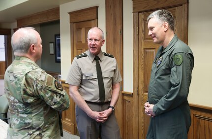 Col. Antanas Matutis, Commander of the Lithuanian Air Force, Command Sgt. Maj. Alvydas Tamošiūnas, Senior Enlisted Leader of the Lithuanian Air Force, and Maj. Romualdas Gečionis, Military Assistant to the Commander of the Lithuanian Air Force, begin a nearly week-long visit to the United States by meeting with Pennsylvania National Guard key leaders including U.S. Army Maj. Gen. Mark Schindler, acting adjutant general, U.S. Air Force Brig. Gen. Michael Regan, deputy adjutant general- Air, U.S. Army Command Sgt. Maj. Jon Worley, senior enlisted leader, and U.S. Air Force Col. Donald O’Shell, director of staff- Air, March 20 at Fort Indiantown Gap. (U.S. Army National Guard photo by Sgt. 1st Class Zane Craig)