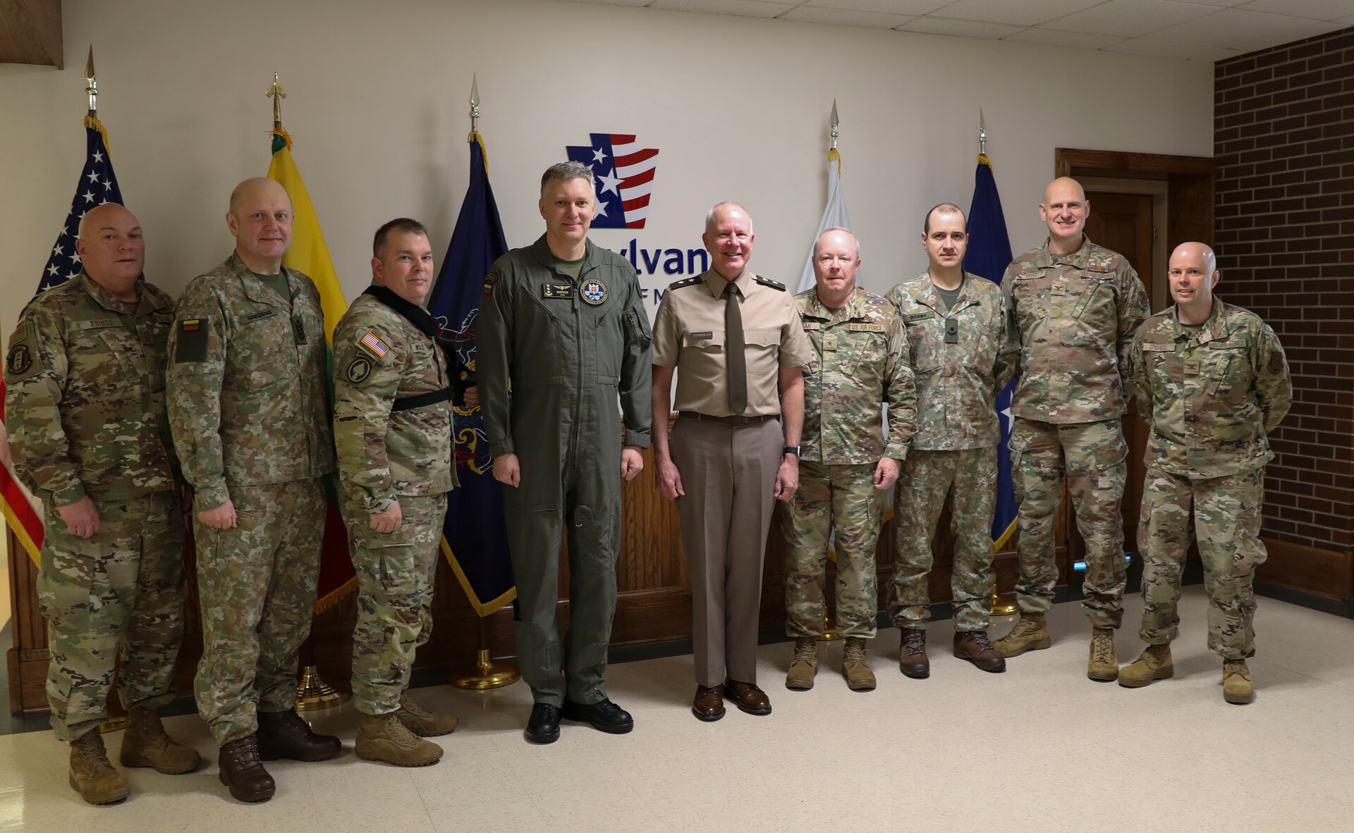 Col. Antanas Matutis, Commander of the Lithuanian Air Force, Command Sgt. Maj. Alvydas Tamošiūnas, Senior Enlisted Leader of the Lithuanian Air Force, and Maj. Romualdas Gečionis, Military Assistant to the Commander of the Lithuanian Air Force, begin a nearly week-long visit to the United States by meeting with Pennsylvania National Guard key leaders including U.S. Army Maj. Gen. Mark Schindler, acting adjutant general, U.S. Air Force Brig. Gen. Michael Regan, deputy adjutant general- Air, U.S. Army Command Sgt. Maj. Jon Worley, senior enlisted leader, and U.S. Air Force Col. Donald O’Shell, director of staff- Air, March 20 at Fort Indiantown Gap. (U.S. Army National Guard photo by Sgt. 1st Class Zane Craig)